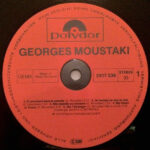 Moustaki*-1